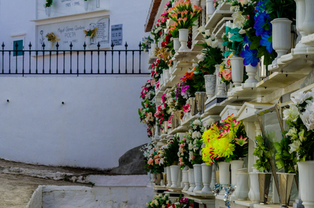 COMARES, SPAIN - 28 JUNE 2018 characteristic of the Spanish burial site in the walls, typical graves in the region of Andalusia, Christianityのeditorial素材