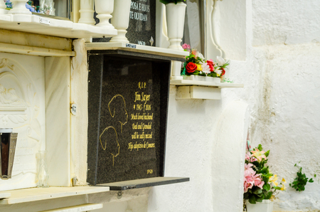 COMARES, SPAIN - 28 JUNE 2018 characteristic of the Spanish burial site in the walls, typical graves in the region of Andalusia, Christianityのeditorial素材
