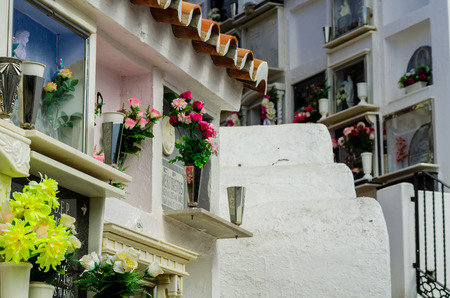 COMARES, SPAIN - 28 JUNE 2018 characteristic of the Spanish burial site in the walls, typical graves in the region of Andalusia, Christianityのeditorial素材