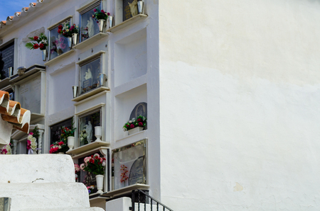 COMARES, SPAIN - 28 JUNE 2018 characteristic of the Spanish burial site in the walls, typical graves in the region of Andalusia, Christianityのeditorial素材
