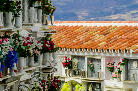 COMARES, SPAIN - 28 JUNE 2018 characteristic of the Spanish burial site in the walls, typical graves in the region of Andalusia, Christianityのeditorial素材