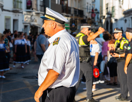 NERJA, SPAIN - JULY 16, 2018 people participating in the celebration of the Catholic ceremony of transferring the holy figure in Spain. The 'Virgen del Carmen' is the patron saint and protector of fishermen and sailorsのeditorial素材