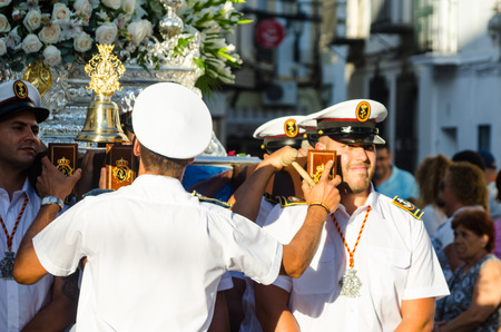 NERJA, SPAIN - JULY 16, 2018 people participating in the celebration of the Catholic ceremony of transferring the holy figure in Spain. The 'Virgen del Carmen' is the patron saint and protector of fishermen and sailorsのeditorial素材