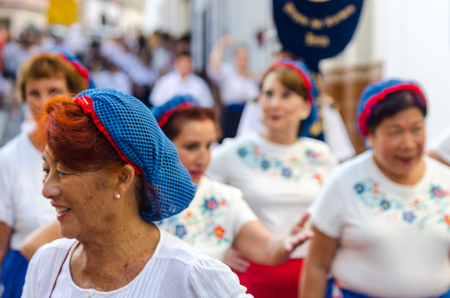 NERJA, SPAIN - JULY 16, 2018 people participating in the celebration of the Catholic ceremony of transferring the holy figure in Spain. The 'Virgen del Carmen' is the patron saint and protector of fishermen and sailorsのeditorial素材