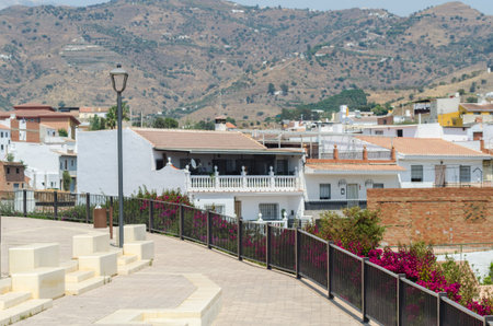 VELEZ-MALAGA, SPAIN - AUGUST 24, 2018 Plants and  trees in the park in a Spanish city, characteristic architecture in the south of Spainのeditorial素材