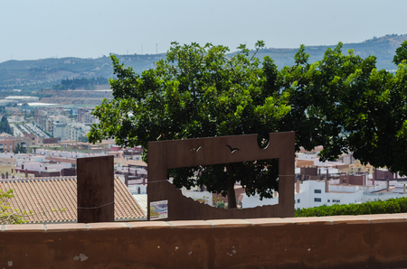 VELEZ-MALAGA, SPAIN - AUGUST 24, 2018 Plants and  trees in the park in a Spanish city, characteristic architecture in the south of Spainのeditorial素材
