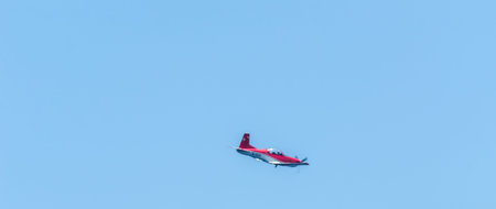 TORRE DEL MAR, SPAIN - JULY 27, 2018 planes flying over the beach in a seaside town, aerobatics...