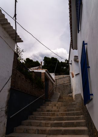 VELEZ-MALAGA, SPAIN - AUGUST 17, 2018 Empty streets during a siesta in a Spanish city, characteristic architecture in the south of Spainのeditorial素材