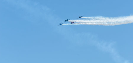 TORRE DEL MAR, SPAIN - JULY 29, 2018 planes flying over the beach in a seaside town, aerobatics...
