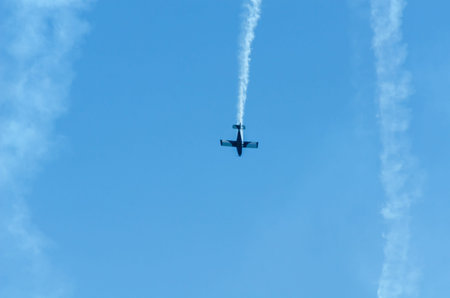 TORRE DEL MAR, SPAIN - JULY 29, 2018 planes flying over the beach in a seaside town, aerobatics...