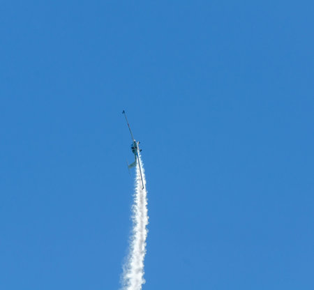 TORRE DEL MAR, SPAIN - JULY 29, 2018 planes flying over the beach in a seaside town, aerobatics...