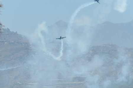 TORRE DEL MAR, SPAIN - JULY 29, 2018 planes flying over the beach in a seaside town, aerobatics airshow in Andalusiaのeditorial素材