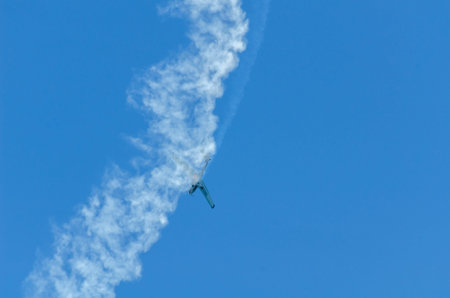 TORRE DEL MAR, SPAIN - JULY 29, 2018 planes flying over the beach in a seaside town, aerobatics...