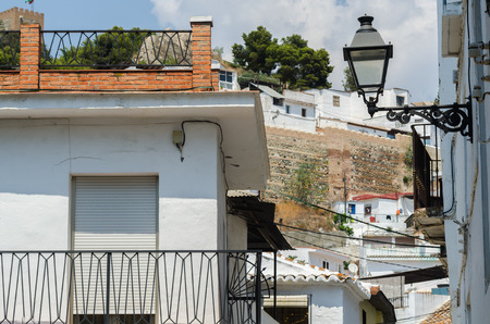 VELEZ-MALAGA, SPAIN - AUGUST 24, 2018 Empty streets during a siesta in a Spanish city, characteristic architecture in the south of Spainのeditorial素材