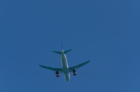 MALAGA, SPAIN - MAY 25, 2018 A passenger plane rising up from the Malaga airport, aerospace industryのeditorial素材