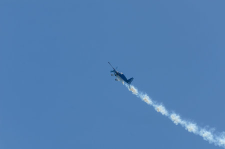TORRE DEL MAR, SPAIN - JULY 29, 2018 planes flying over the beach in a seaside town, aerobatics...