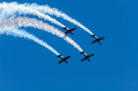TORRE DEL MAR, SPAIN - JULY 29, 2018 planes flying over the beach in a seaside town, aerobatics...