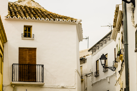 BAENA, SPAIN - SEPTEMBER 12, 2018 Empty Spanish streets in a small town next to Cordoba, the characteristic architecture of old Andalusiaのeditorial素材
