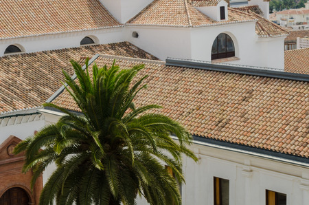 VELEZ-MALAGA, SPAIN - AUGUST 17, 2018 roofs and facades of buildings in a Spanish city, characteristic architecture in the south of Spainのeditorial素材