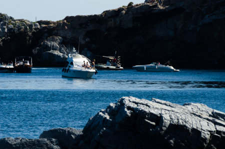LA HERRADURA, SPAIN - MAY 26, 2018 A beautiful bay with people on the luxury yachts and motor boats in the tourist seaside town of La Herraduraのeditorial素材