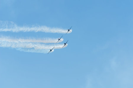TORRE DEL MAR, SPAIN - JULY 29, 2018 planes flying over the beach in a seaside town, aerobatics...
