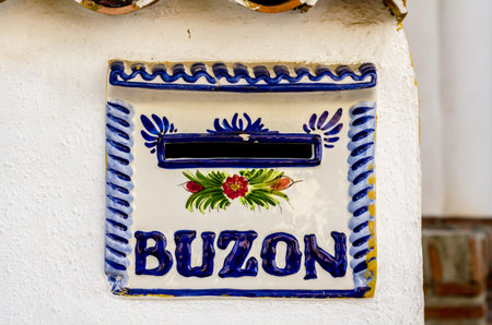 Old letterbox in the wall, traditional way of delivering letters to the house, old mailbox,...