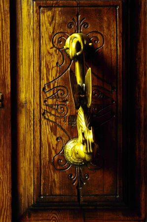 Door with brass knocker in the shape of a decor, beautiful entrance to the house, vintage decorationの写真素材