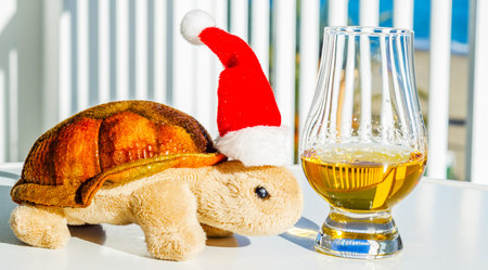Turtle with single malt whiskey glass, symbol of Christmas holiday, Xmas set decoration