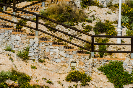 Wooden promenade along the sea coast situated on a cliff rock in Rincon de la Victoria, Costa del Sol, Andalusia, Spainの写真素材