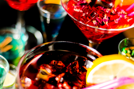Tasty and colorful drinks based on various alcohols, syrups and liqueurs, unique effect of the bartender's work, party nightの写真素材
