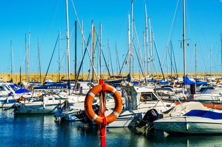 TORREDEMBARRA, SPAIN - SEPTEMBER 10, 2017   A beautiful marina with luxury yachts and motor boats in...