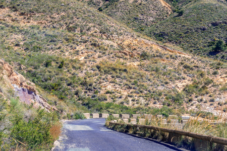 Empty and narrow road in the mountains leading from the famous tourist place Battery Castilitos, beautiful views from the hillsの写真素材