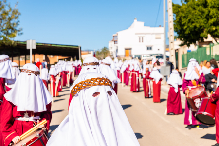 VELEZ-MALAGA, SPAIN - MARCH 27, 2018 People participating in the procession  in the Holy Week in a Spanish city, easterのeditorial素材