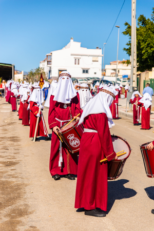 VELEZ-MALAGA, SPAIN - MARCH 27, 2018 People participating in the procession  in the Holy Week in a Spanish city, easterのeditorial素材