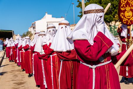 VELEZ-MALAGA, SPAIN - MARCH 27, 2018 People participating in the procession  in the Holy Week in a Spanish city, easterのeditorial素材