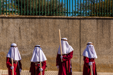 VELEZ-MALAGA, SPAIN - MARCH 27, 2018 People participating in the procession  in the Holy Week in a Spanish city, easterのeditorial素材