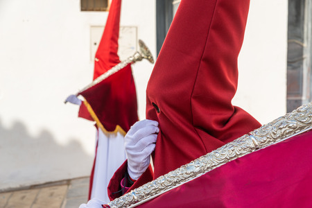 VELEZ-MALAGA, SPAIN - MARCH 29, 2018 People participating in the procession  in the Holy Week in a Spanish city, easterのeditorial素材