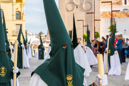 VELEZ-MALAGA, SPAIN - MARCH 29, 2018 People participating in the procession  in the Holy Week in a...