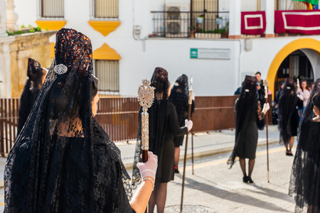 VELEZ-MALAGA, SPAIN - MARCH 29, 2018 People participating in the procession  in the Holy Week in a Spanish city, easterのeditorial素材