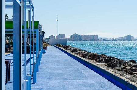LA MANGA, SPAIN - MARCH 4, 2019  Outdoors restaurant near the beach in La Manga is a seaside spit in the Region of Murciaのeditorial素材