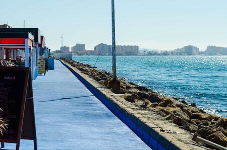 LA MANGA, SPAIN - MARCH 4, 2019  Outdoors restaurant near the beach in La Manga is a seaside spit in the Region of Murciaのeditorial素材