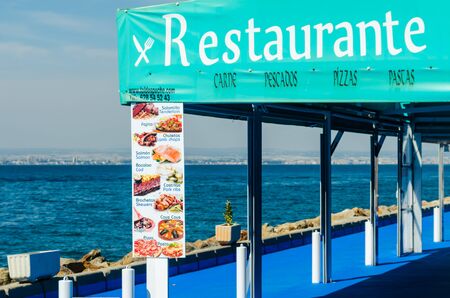 LA MANGA, SPAIN - MARCH 4, 2019  Outdoors restaurant near the beach in La Manga is a seaside spit in the Region of Murciaのeditorial素材
