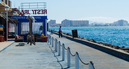 LA MANGA, SPAIN - MARCH 4, 2019  Outdoors restaurant near the beach in La Manga is a seaside spit in...