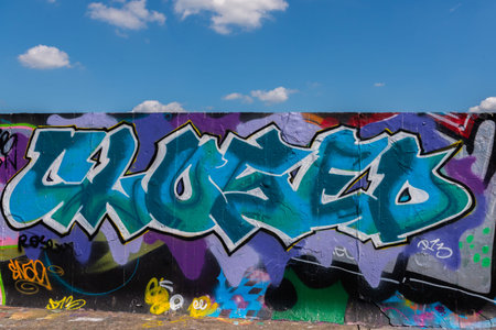 LONDON, UK - MAY 21, 2019 Grafitti on the wall in the city park, a place for legal painting with spray paints, street paintingのeditorial素材