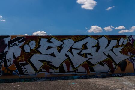 LONDON, UK - MAY 21, 2019 Grafitti on the wall in the city park, a place for legal painting with spray paints, street paintingのeditorial素材