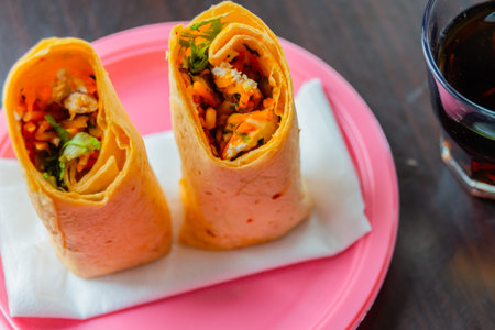 Chicken breast with piri piri sauce and lettuce in a chili tortilla wrap, tasty food
