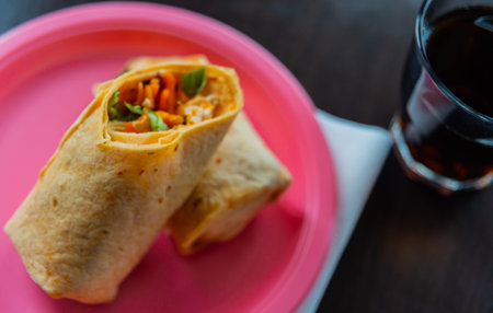 Chicken breast with piri piri sauce and lettuce in a chili tortilla wrap, tasty food