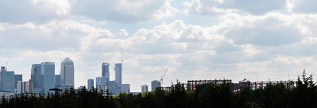 LONDON, UK - MAY 21, 2019 Landscape showing the famous skyscrapers of Canary Wharf in the distance,...