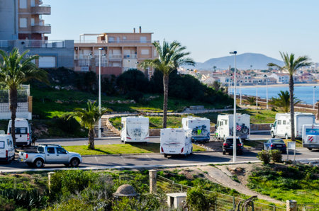 CABO DE PALOS, SPAIN - FEBRUARY 07, 2019 Free caravan park in an attractive location on the seafront...