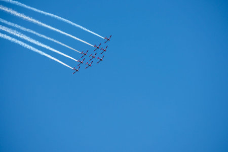 TORRE DEL MAR, SPAIN - JULY 29, 2018 planes flying over the beach in a seaside town, aerobatics...